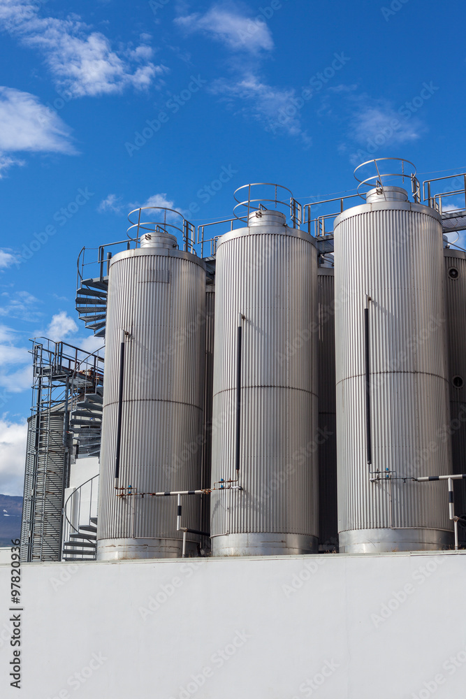 Giant industrial tanks on the bright blue sky Giant industrial tanks on the bright blue sky