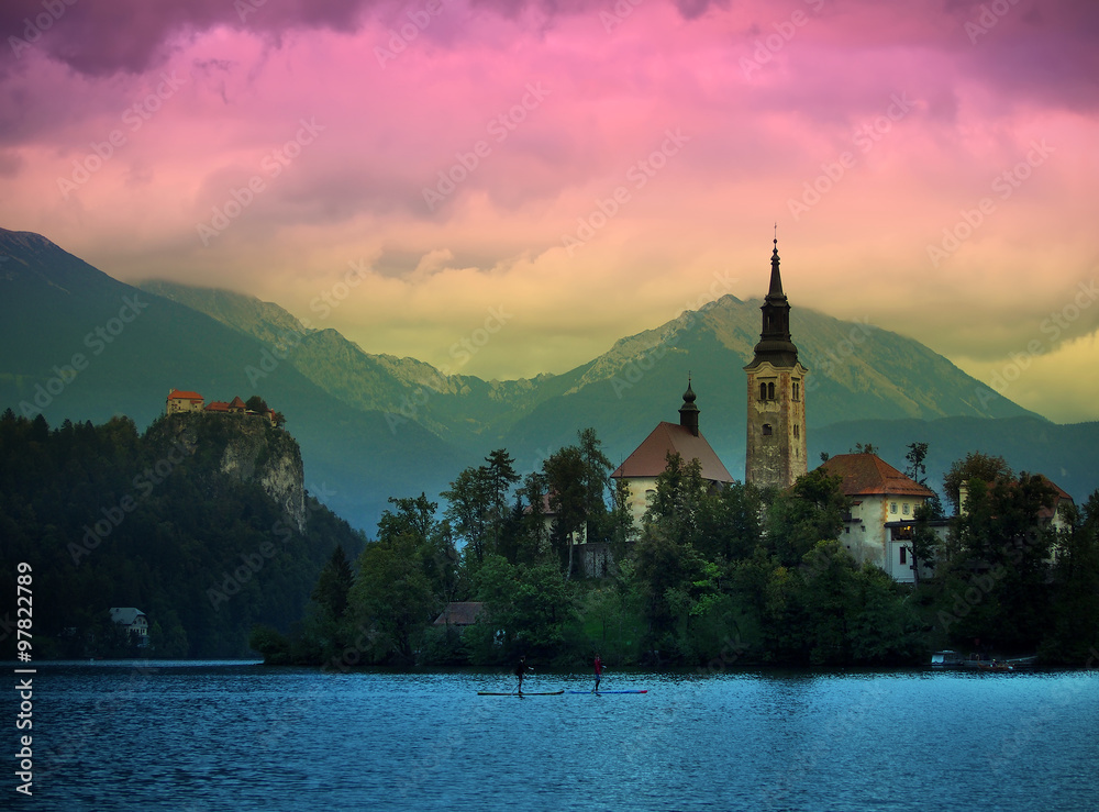 Fototapeta premium Sunset view of Julian Alps, Lake Bled with St. Marys Church of the Assumption on the small island; Bled, Slovenia, Europe