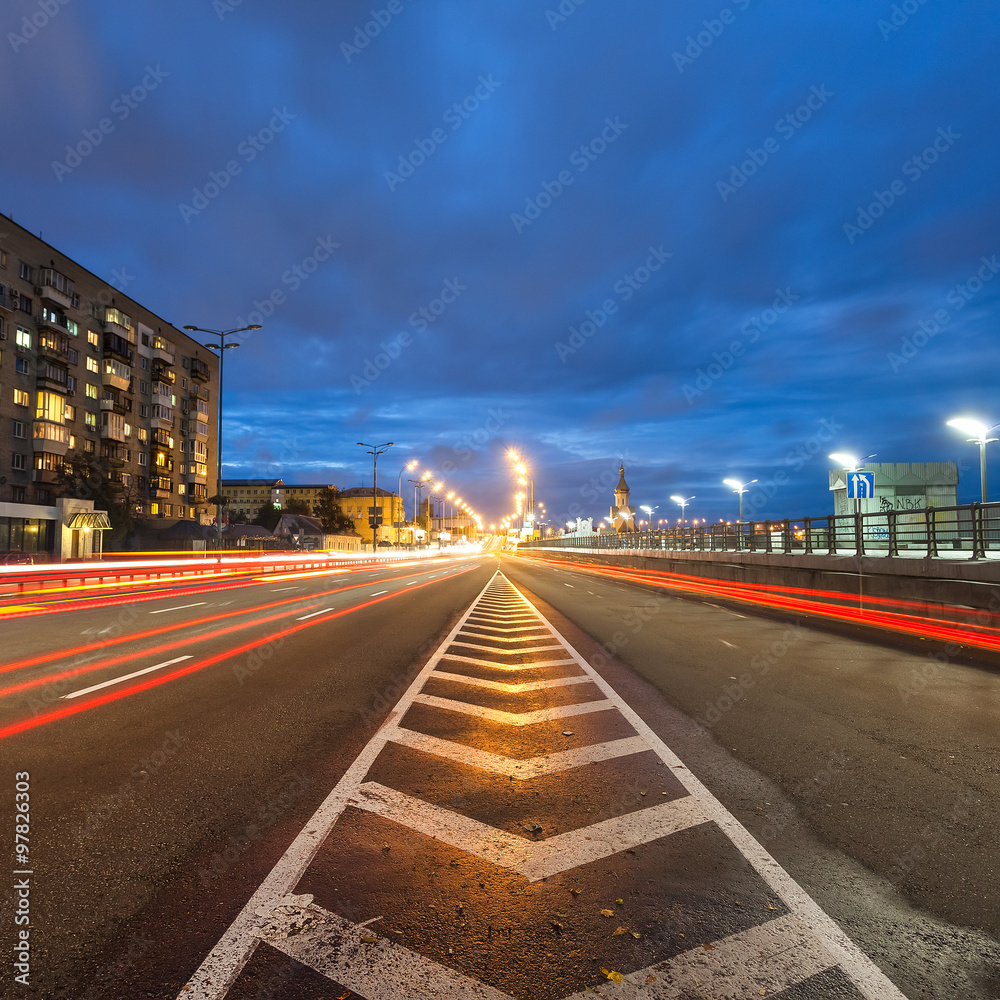Car light trails and urban landscape. Moving car with blur light through city at night. Kiev city, Ukraine. Car light trails and urban landscape. Moving car with blur light through city at night. Kiev city, Ukraine.