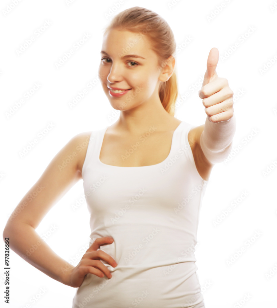Happy smiling young woman with thumbs up gesture Happy smiling young woman with thumbs up gesture