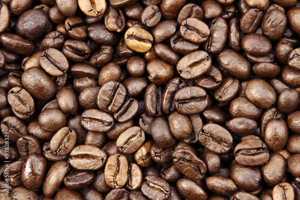 Close-up of roasted brown coffee beans background Close-up of roasted brown coffee beans background
