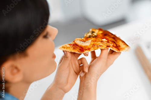 Eating Fast Food. Close-up Of Happy Beautiful Healthy Woman Eating Italian Pizza At Home. Nutrition And Dieting. Lifestyle Concept. 