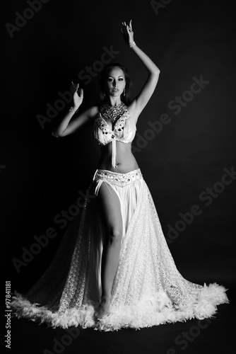 Beautiful woman in white belly dance costume 