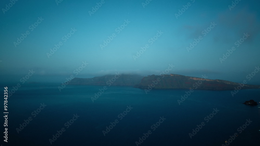 Timelapse vacation shot at the caldera of the Greek island of Santorini showing the transition from night to dawn.
Timelapse vacation shot at the caldera of the Greek island of Santorini showing the transition from night to dawn.
