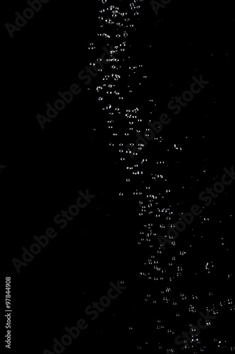 Abstract splashes and drops of water on black background. © Vagengeim