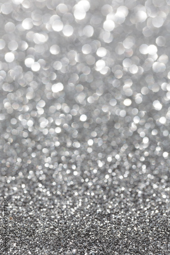 Silver sparkle. Glitter background. Holiday blurred background.