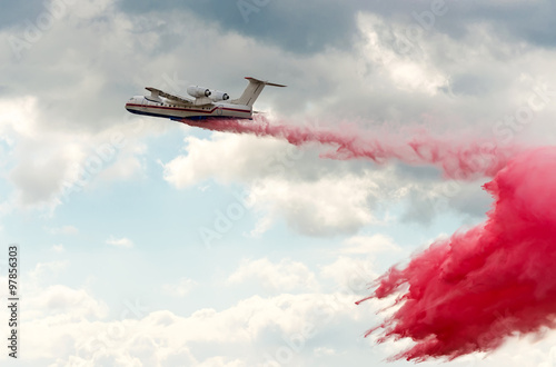 Flying aerial firefighting pour water photo