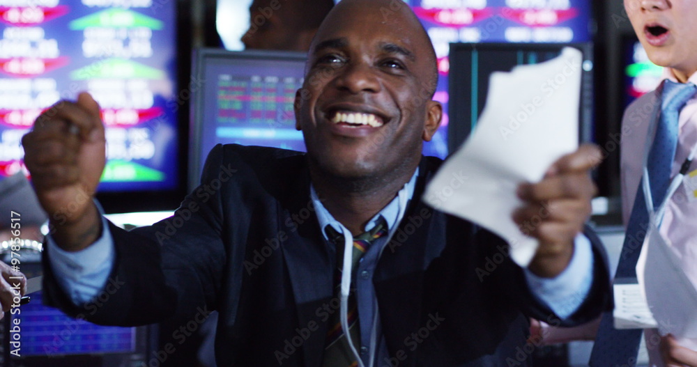  Financial traders in busy stock exchange celebrate making lots of money