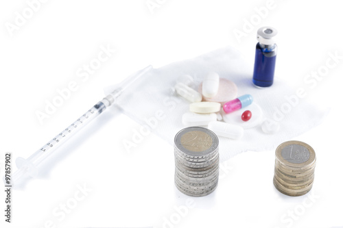 conceptual image with medicine and money.