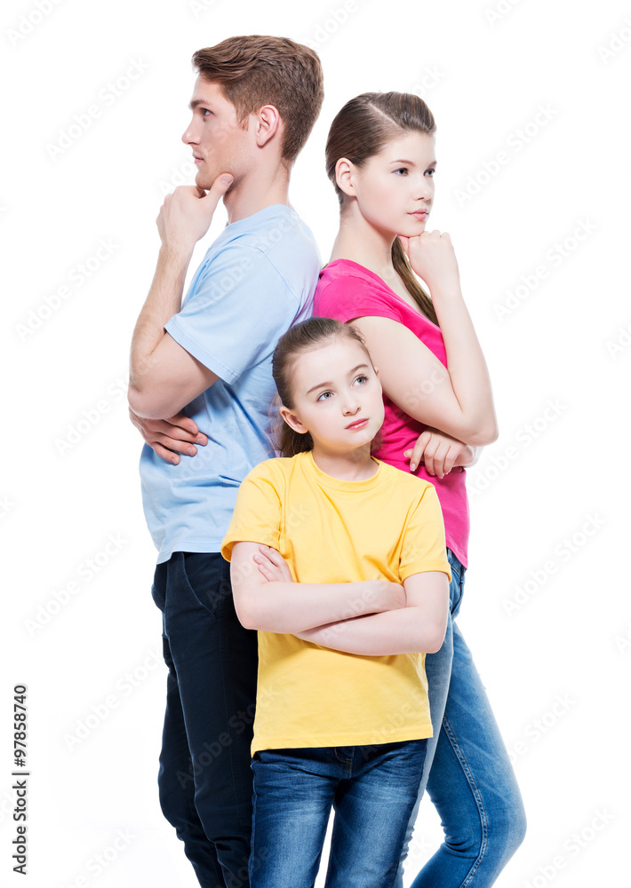 Thoughtful family with daughter standing back to back at studio - isolated on white. Thoughtful family with daughter standing back to back at studio - isolated on white.