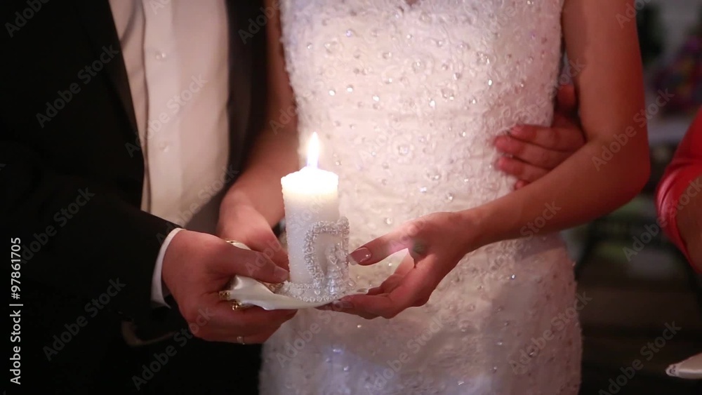 bride and groom holding candles in their hands bride and groom holding candles in their hands
