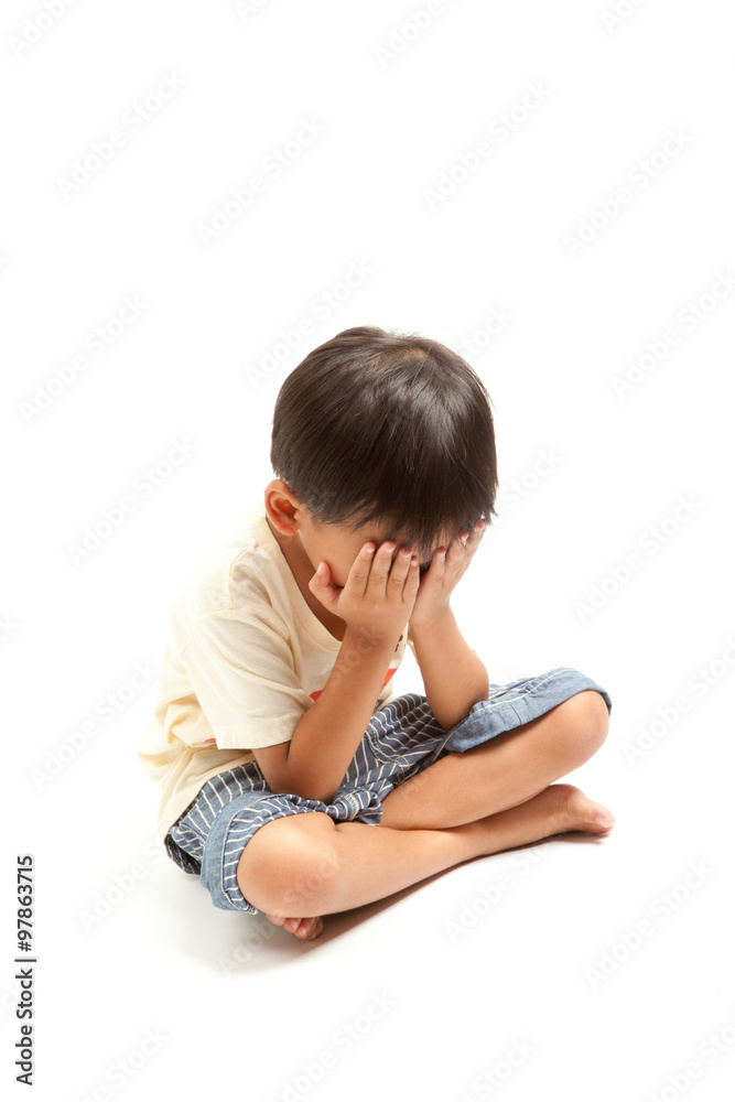 Angry sad crying child boy punishment ,solated on white background Angry sad crying child boy punishment ,solated on white background