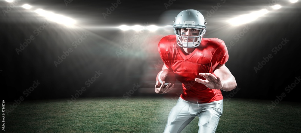 American football player holding ball