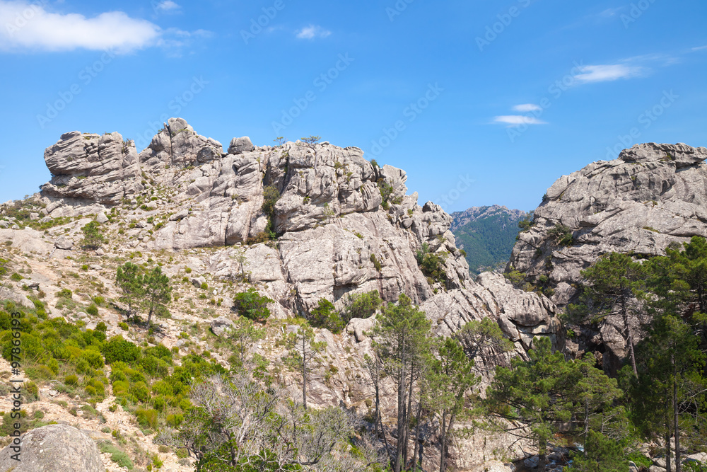 Fototapeta premium Wild mountain landscape, rocks under blue sky