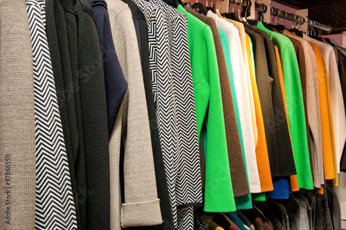 Rack of Colorful Garments Hanging on Rod