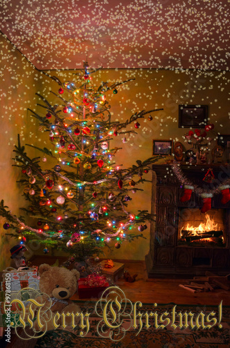 Holiday living room with the Christmas tree, gifts and a firepla