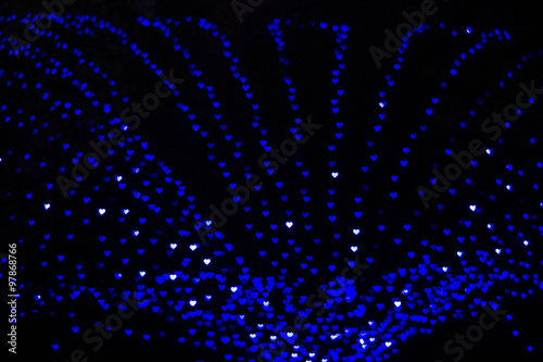 Blue hearts bokeh blur lights. Winter holidays lights. photo