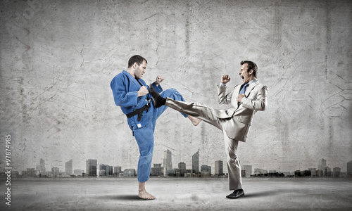 Karate man in blue kimino © Sergey Nivens