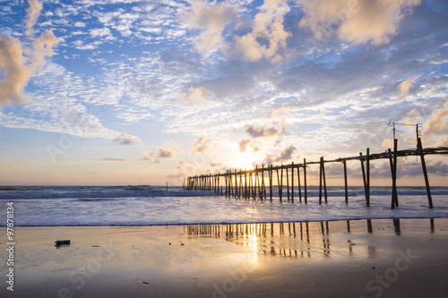 old wooden bridge at Natai beach with beautiful sky