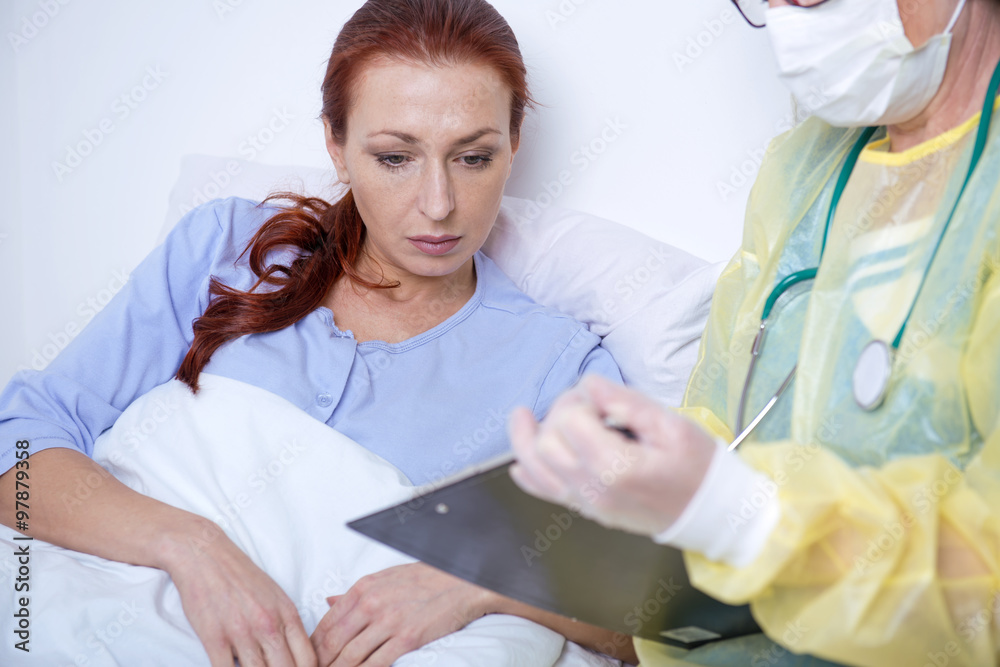 sick patient talking to a nurse in the hospital sick patient talking to a nurse in the hospital