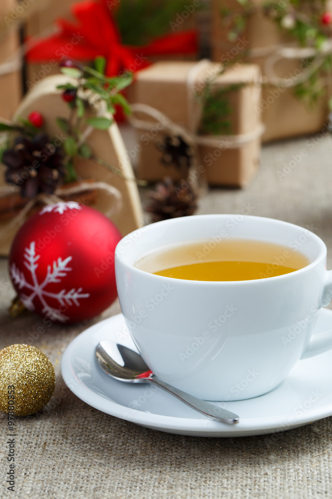 Christmas table with green tea and christmas balls. Christmas table with green tea and christmas balls.
