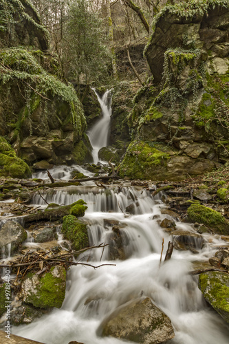 Beautiful view of Leshnishki Waterfall in deep forest, Belasitsa Mountain, Bulgaria