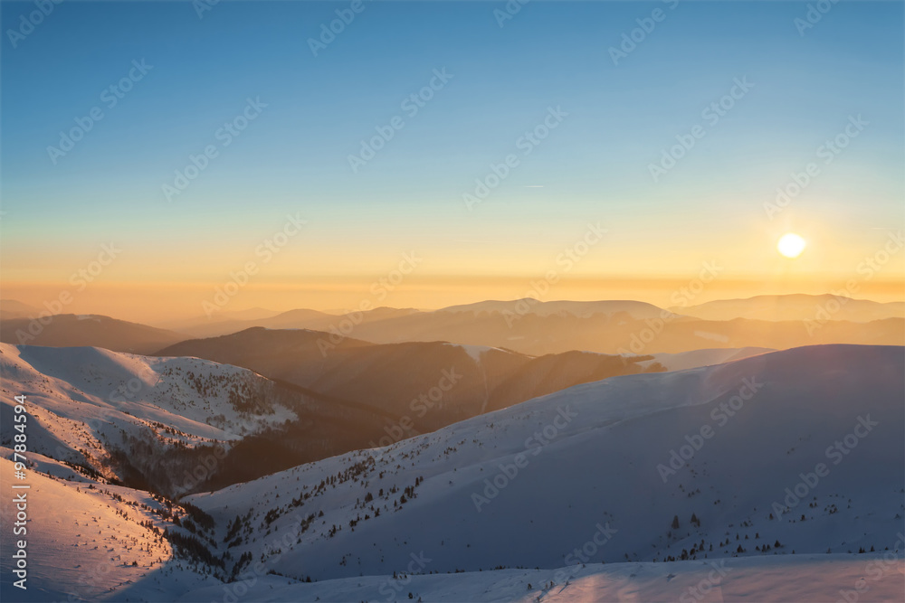 Sunset in winter mountains. Sunny landscape. Sunset in winter mountains. Sunny landscape.
