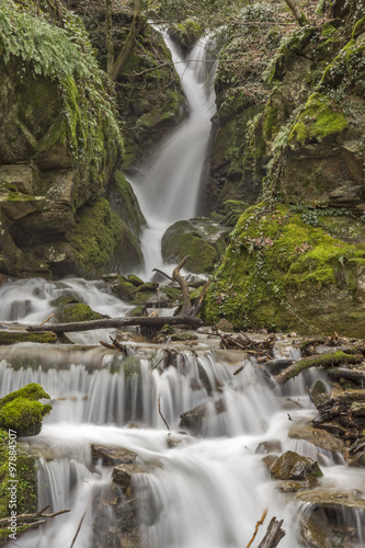 wonderful view of Leshnishki Waterfall in deep forest, Belasitsa Mountain, Bulgaria