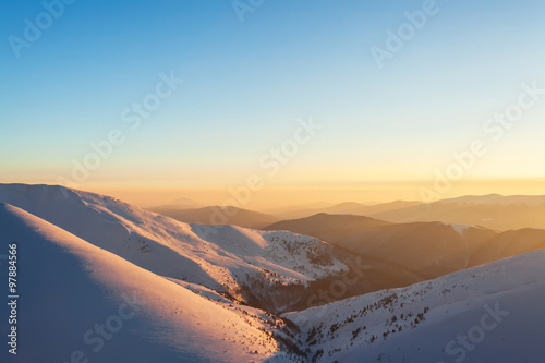 Evening glow in winter mountains. © Maxim Khytra