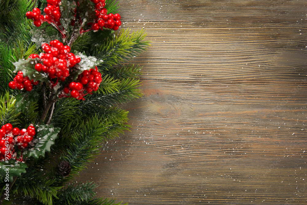 Christmas fir tree branches with rowan on wooden table Christmas fir tree branches with rowan on wooden table
