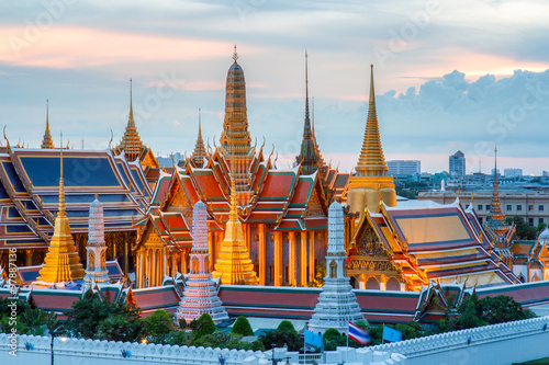 The beauty of the Emerald Buddha Temple at twilight. And while the gold of the temple catching the light. This is an important buddhist temple of thailand and a famous tourist destination.