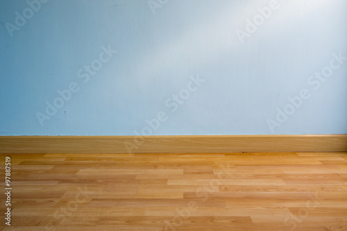 wood floor and light blue wall for background