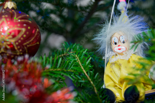 Clown and Christmas Ball Christmas-Tree Decorations on a Christmas-Tree Branch