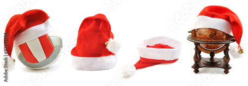 Collection of Santa's hats  lined up on white.