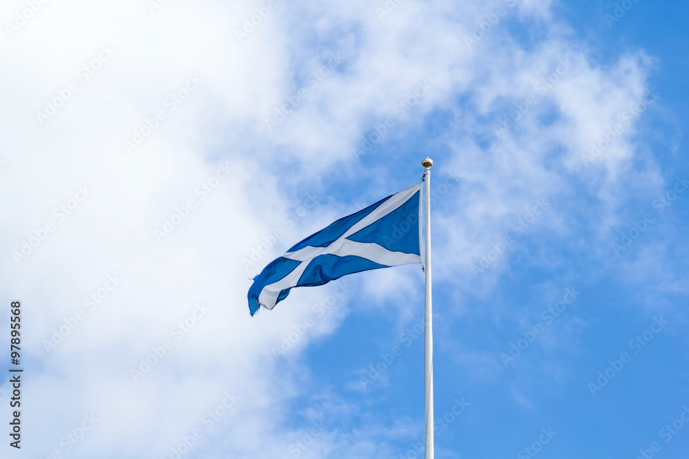 Scottish flag against blue sky Scottish flag against blue sky