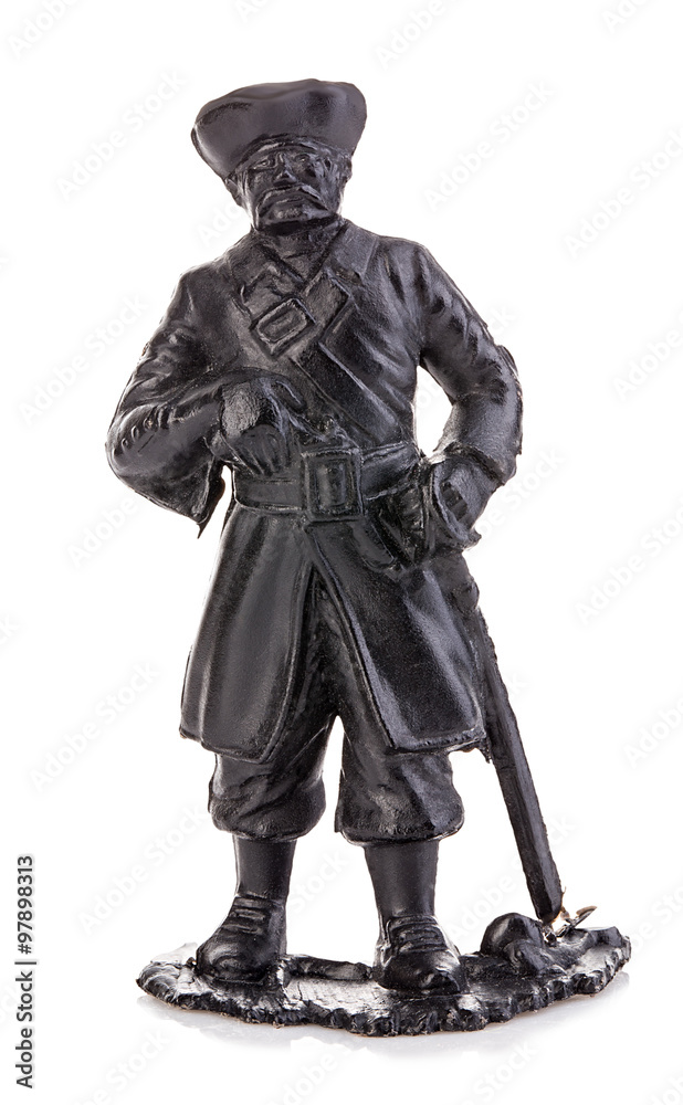 Fototapeta premium Old pirate captain in authentic looking costume close-up isolated on a white background. Miniature figurine of a children's toy.
