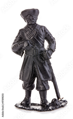 Old pirate captain in authentic looking costume close-up isolated on a white background. Miniature figurine of a children's toy.