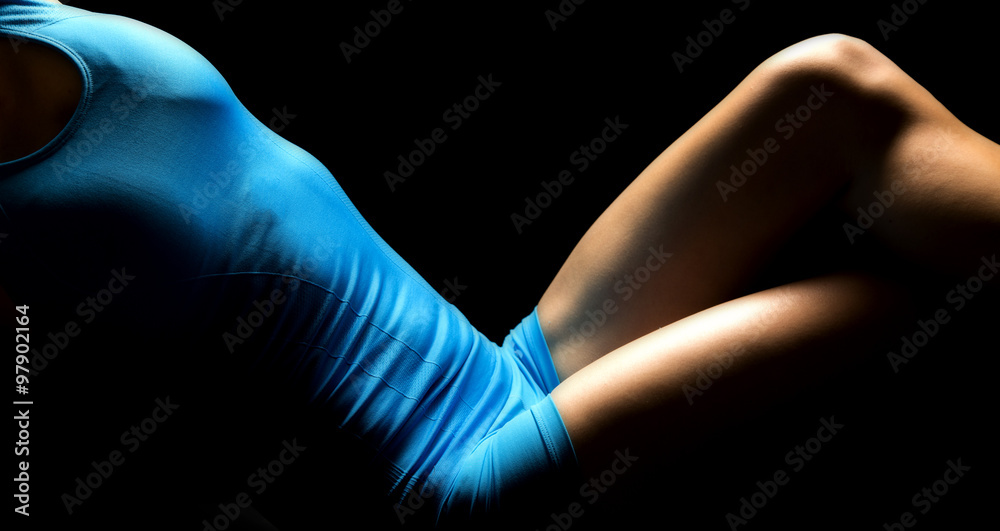 woman body in blue hightlighted lean back legs crossed