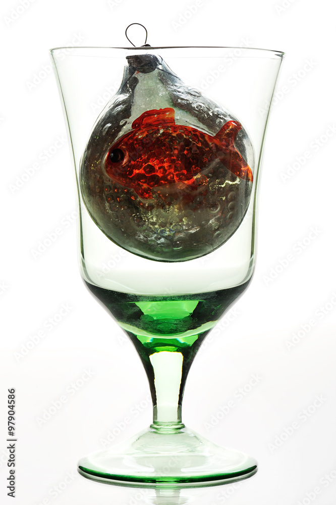 glass with toy on white background glass with toy on white background