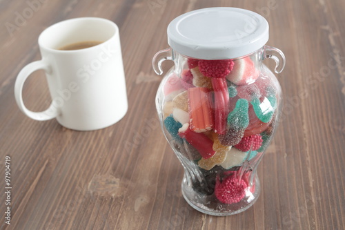 candy jar filled glass on a wooden table 