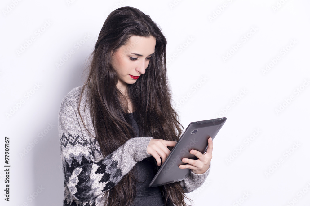 Girl using tablet computer, working on touching screen. Girl using tablet computer, working on touching screen.