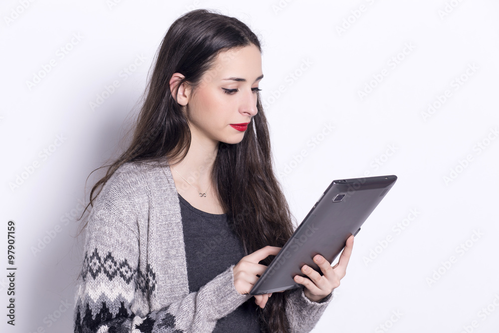 Girl using tablet computer, working on touching screen. Girl using tablet computer, working on touching screen.