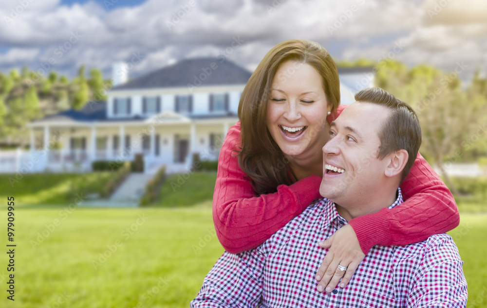 Fototapeta premium Happy Couple Outdoors In Front of Beautiful House
