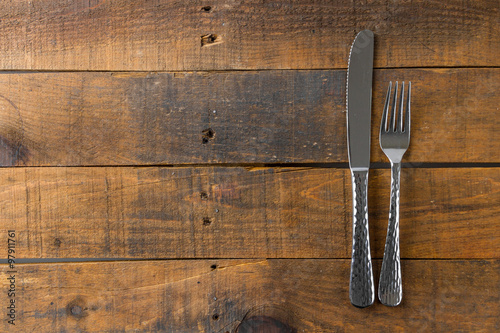 fork and knife on wood