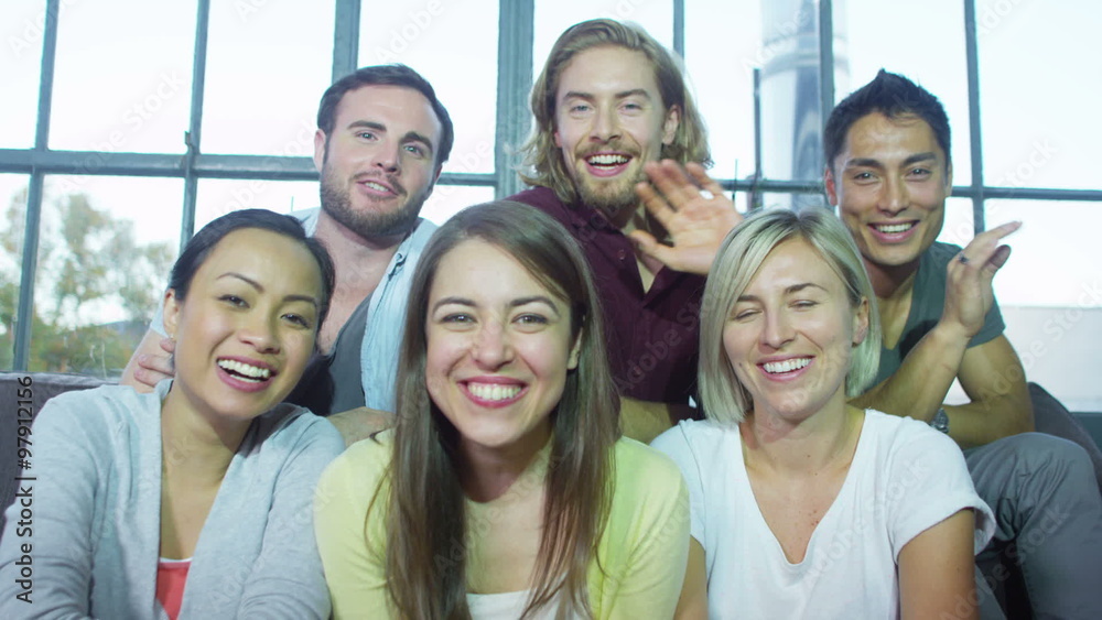 Attractive young people having a video chat with friends Attractive young people having a video chat with friends