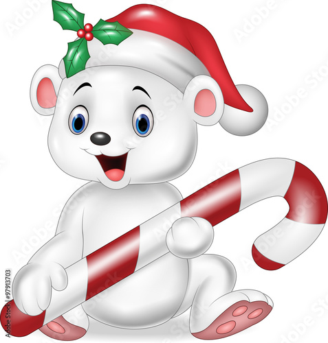Cute baby polar bear holding Christmas candy