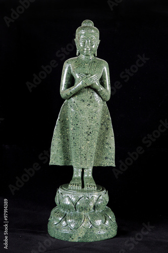 Jade sculpture of buddha isolated on black background