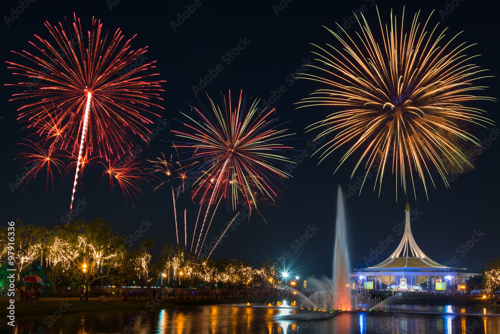Beautiful building in public park on night sky with fountain foreground and fireworks backgrond. Suanluang Rama 9, Thailand. Beautiful building in public park on night sky with fountain foreground and fireworks backgrond. Suanluang Rama 9, Thailand.