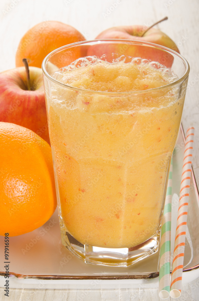 apple and orange smoothie in a glass apple and orange smoothie in a glass