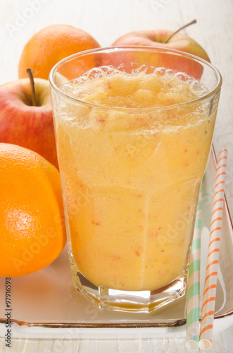 apple and orange smoothie in a glass